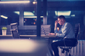 man working on laptop in dark office - PhotoDune Item for Sale