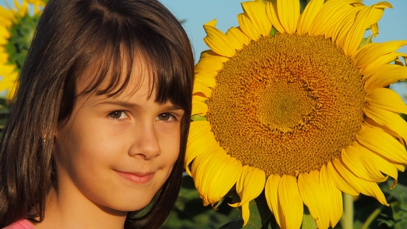 Little Girl with a Big Sunflower