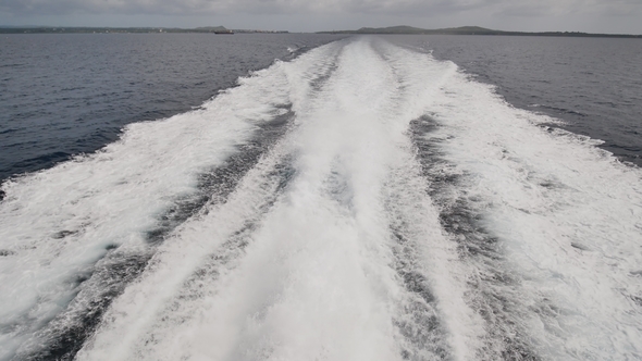 Background of Water Trail Foaming Behind a Ferry Boat.