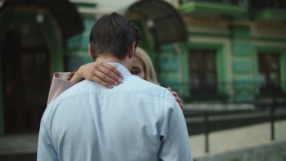 Romantic Business Couple Hugging Outside. Lovely Couple Looking at Date