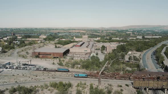 Aerial view; drone moving around production site of steel plant