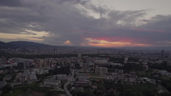 Evening Sunset and Dark Clouds Over the Skyline of the City