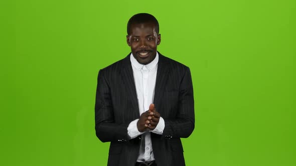 Black African American Guy Claps His Hands and Smiles. Green Screen