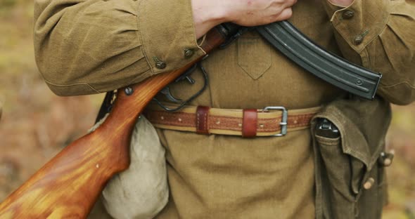 Reenactor Dressed As Russian Soviet Soldier Of World War II Holding In HandsSubmachine Gun