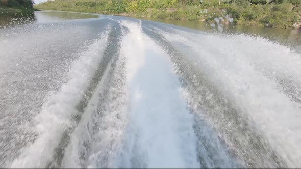 A Tail of a Trace of the High-speed Motor Boat on a Surface of the Water on the River