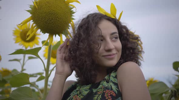 Portrait of Cute Fun Curly Playful Sensual Woman Looking at the Camera Smiling Standing in