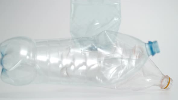 Slow Motion of Plastic Bottles Falling Shot at 1000 Fps in White Background