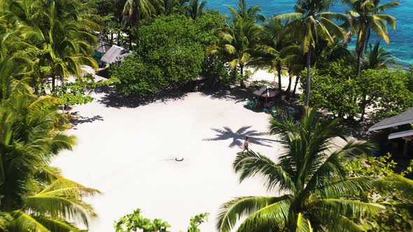 Hut Cottages With Dense Tropical Forest At Kalanggaman Island In Palompon, Province of Leyte, Philip