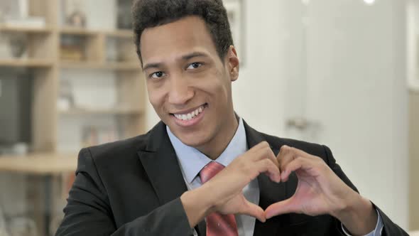 Heart Sign By African Businessman