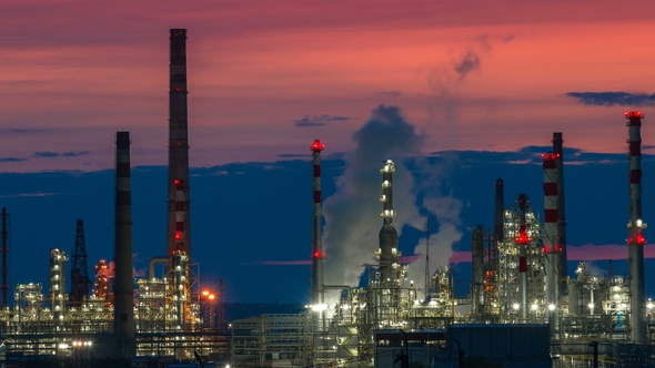 Oil and Gas Refinery Factory and Smoke Stack at Twilight