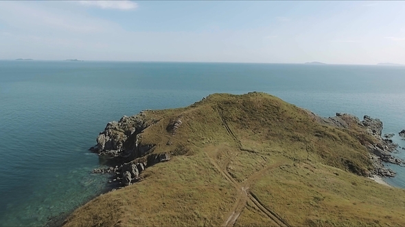 Aerial above Cliff on Sunny Day