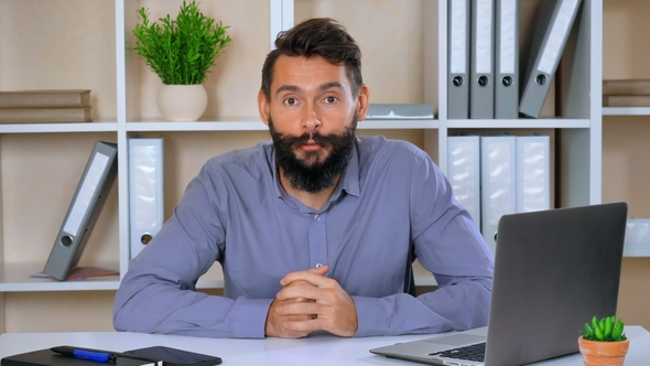 Portrait Business Man Giving Interview or Presentation