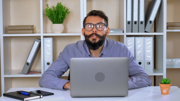 Employee Amusingly Using Computer