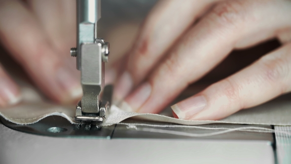Shot of Female Hands Working on Sewing Machine. Young Woman Concept Designer Working on a Sewing