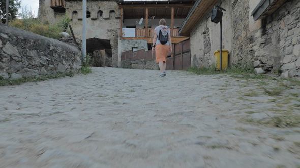 Girl Walks in the Old City Mestia, Georgia