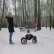 Side View of a Young Mother Walking with a Baby Stroller - VideoHive Item for Sale