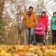 Family Couple with Teenage Girl and an Infant on Way to Park - VideoHive Item for Sale