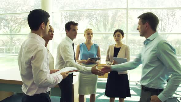 Business team wrapping up meeting