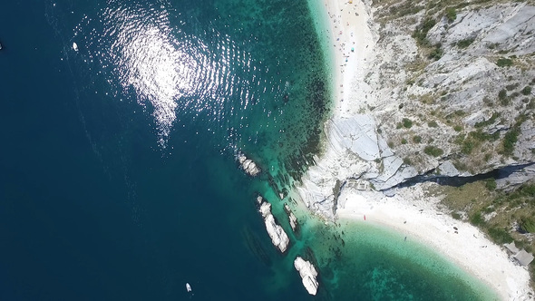 Italian Riviera: Due Sorelle Beach (Marche, Italy) with people sundiving