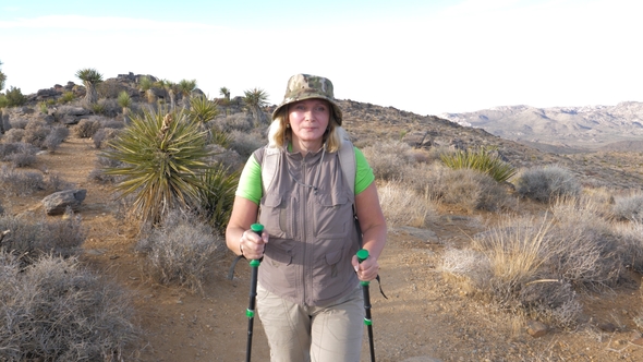 Active Mature Woman Hiking On the Trail Is In the Mojave Desert, Front View