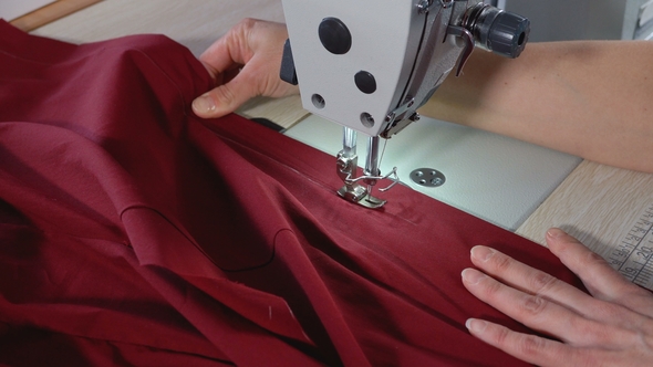 The Seamstress Sews on an Industrial Sewing Machine