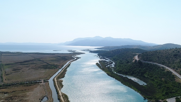 Aerial View of Wide River Falling into the Sea