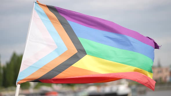 LGBTQ Rainbow Flag in a Residential Harbour Area European City Closeup