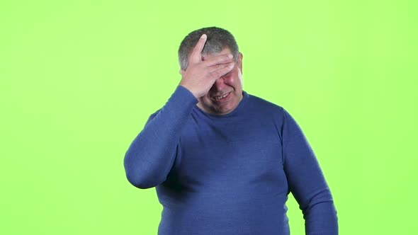 Headache Torments Middle Aged Man. Green Screen. Slow Motion