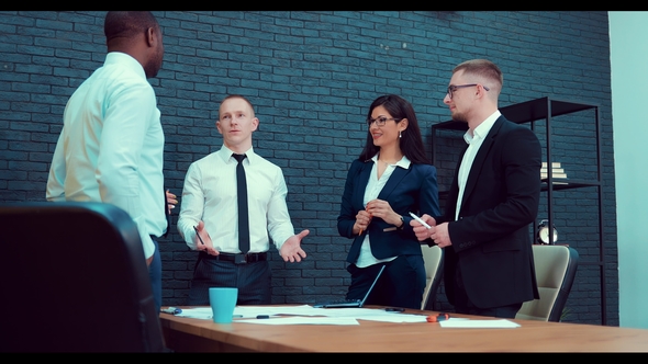 Mixed Race Group of Architects on Business Meeting in Modern Office