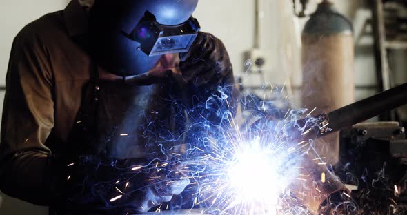 Welder welding a metal