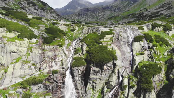 AERIAL: Revealing Majestic Mountain Waterfall in High Tatras in Slovakia