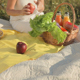 The Woman Takes out Fruit and Drinks from the Basket - VideoHive Item for Sale