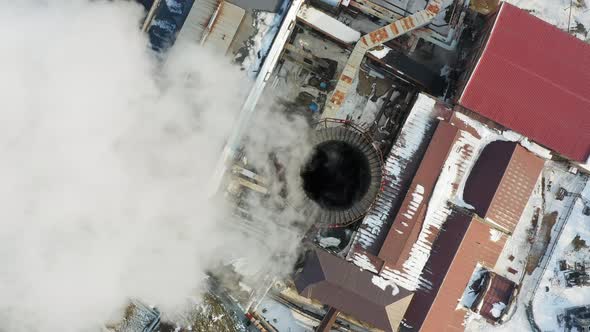 Aerial Video on the Chimney of an Power Plant From Which White Smoke Comes Out