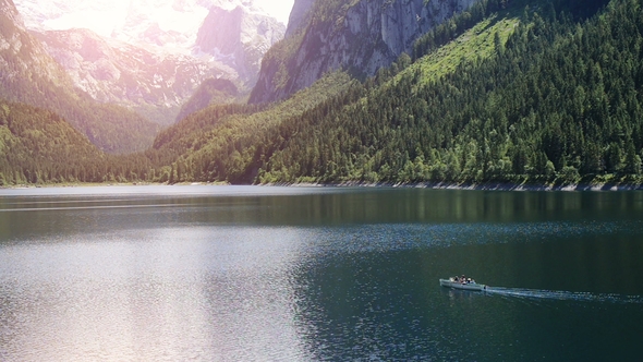 Beautiful Mountain Lake in the Morning with Snow-capped Alps in the Background