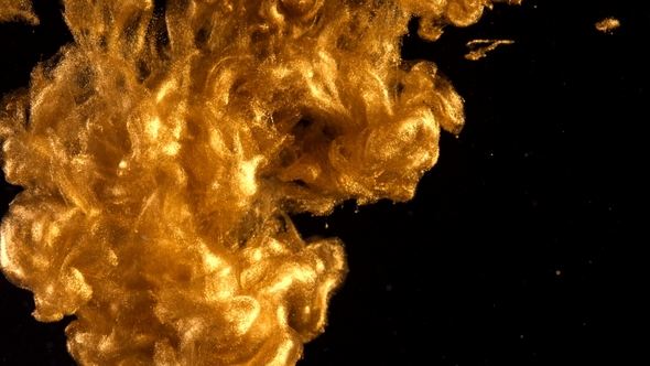 Ink in Water. Colour Golden Glitter Paint Reacting in Water Creating Abstract Cloud formations alt