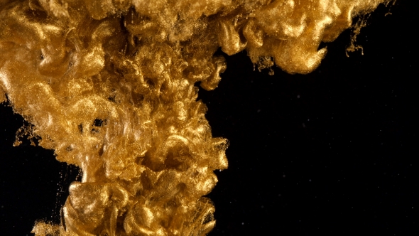 Ink in Water. Colour Golden Glitter Paint Reacting in Water Creating Abstract Cloud formations.Can alt