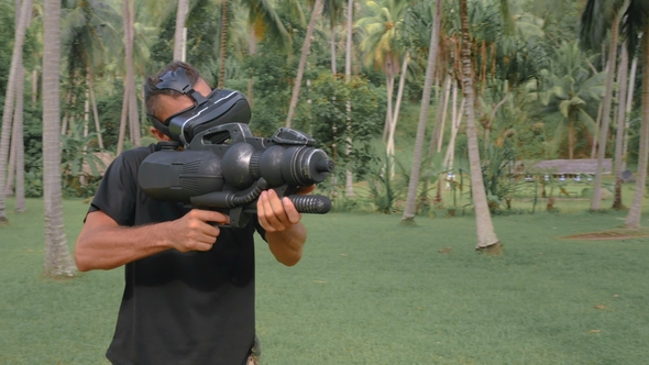 Man with Weapon Playing Virtual Reality Game in the Jungle