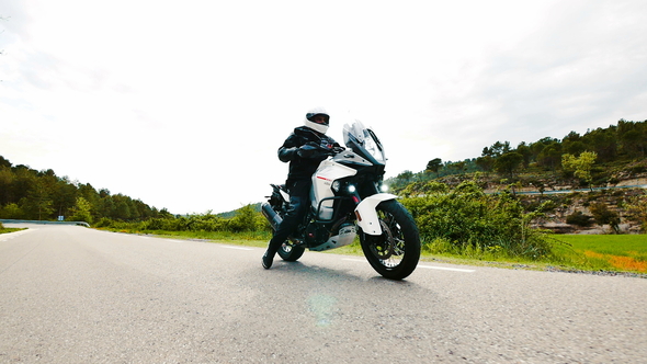 Motorcyclist Driving his Sports Motorbike on a Curvy Road Slow Motion