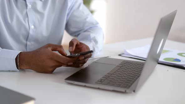 Closeup View of Male Hands Typing on Smartphone Keyboard