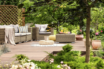blanket and pillows on wooden patio