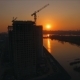 Aerial View Shot of the Sunset on the Construction of a New District on the Bank of the Yenisei - VideoHive Item for Sale