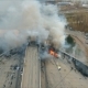 Aerial View of the Brave Firefighters Extinguish a Large Fire on the Roof of the Building - VideoHive Item for Sale
