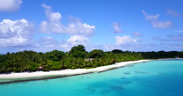 Luxury above abstract shot of a sunshine white sandy paradise beach and blue water background in bes