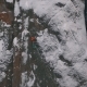 Aerial View of a Rock Climber Climbing a Steep Cliffs During a Sunny Winter Day - VideoHive Item for Sale