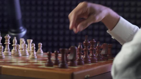 Robot Playing Chess with a Man, the Confrontation Between Man and Artificial Intelligence