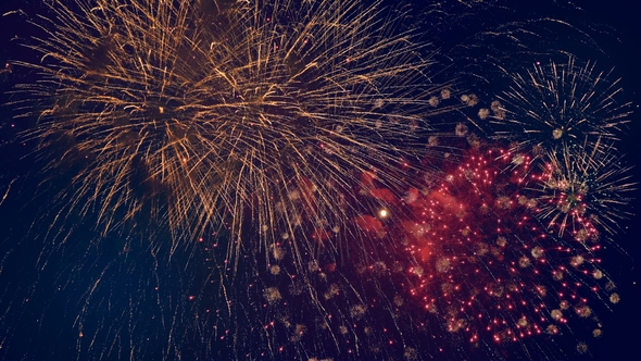 Lots of Colorful Bursts in a Night Sky. Multicolored Fireworks Burst, During a Patriotic Holiday