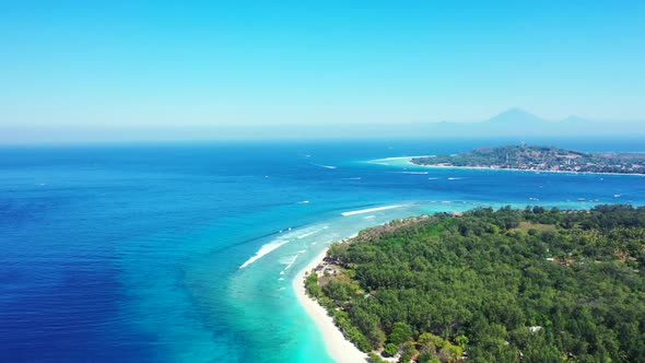 Aerial view scenery of tranquil lagoon beach time by blue ocean and white sandy background of a dayo