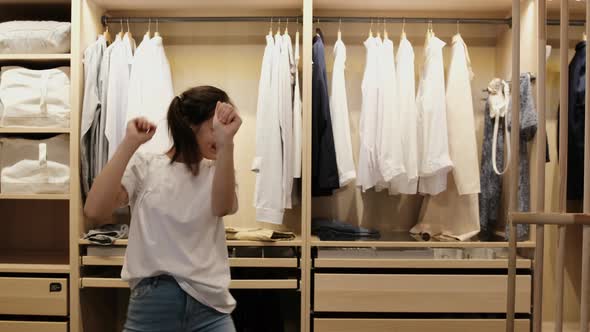 Young Happy Girl Dancing in Dressing Room at Home