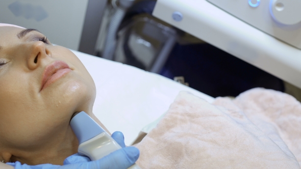 Young Woman Relax During the Rf-lifting Procedure of Lifting Chin