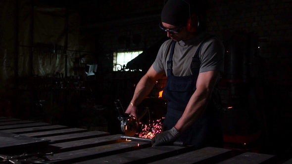 Industrial Engineer Working on Cutting Steel with Compound Mitre Saw